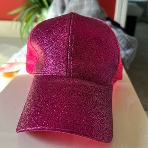 Pink sparkle hat with ponytail hole.